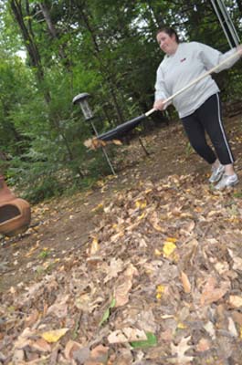 Lisa raking up the leaves.