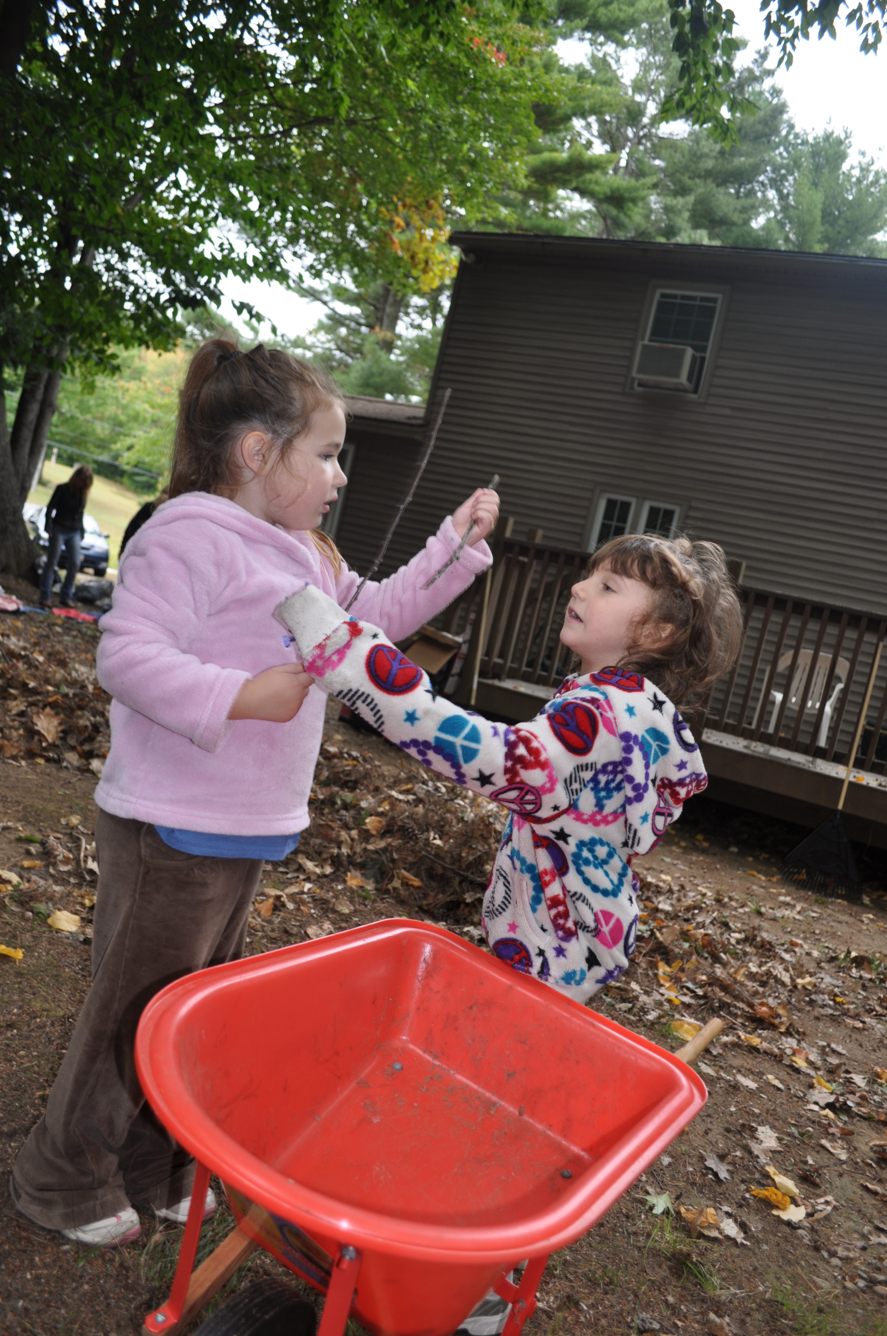 The girls discussing sticks.