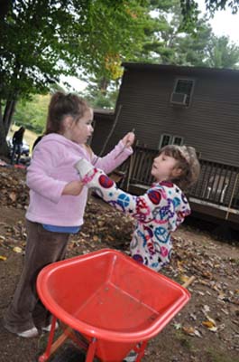 The girls discussing sticks.