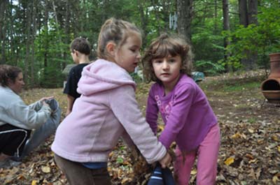 Samantha and Angelina helping each other.