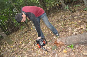 Mark tries to start the new chain saw.