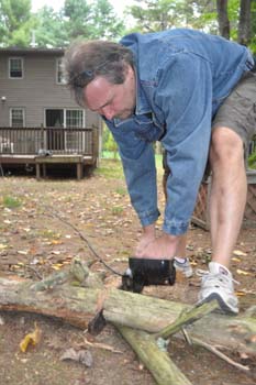 Mike cutting some wood.